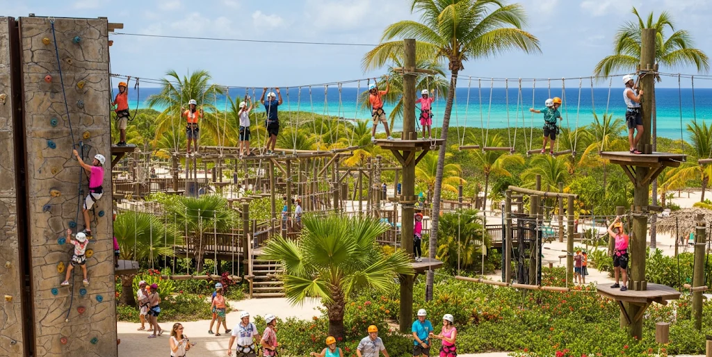 Visitors enjoying various activities at Bavaro Adventure Park, surrounded by lush greenery and stunning views.